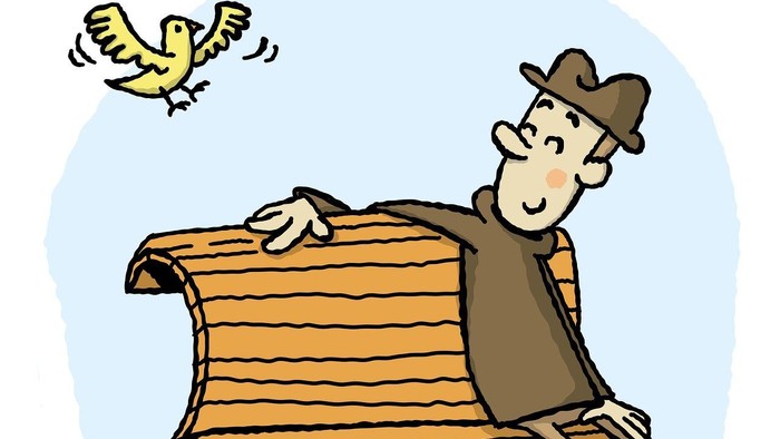 Mand siddende på bænk kiggende på flyvende fugl